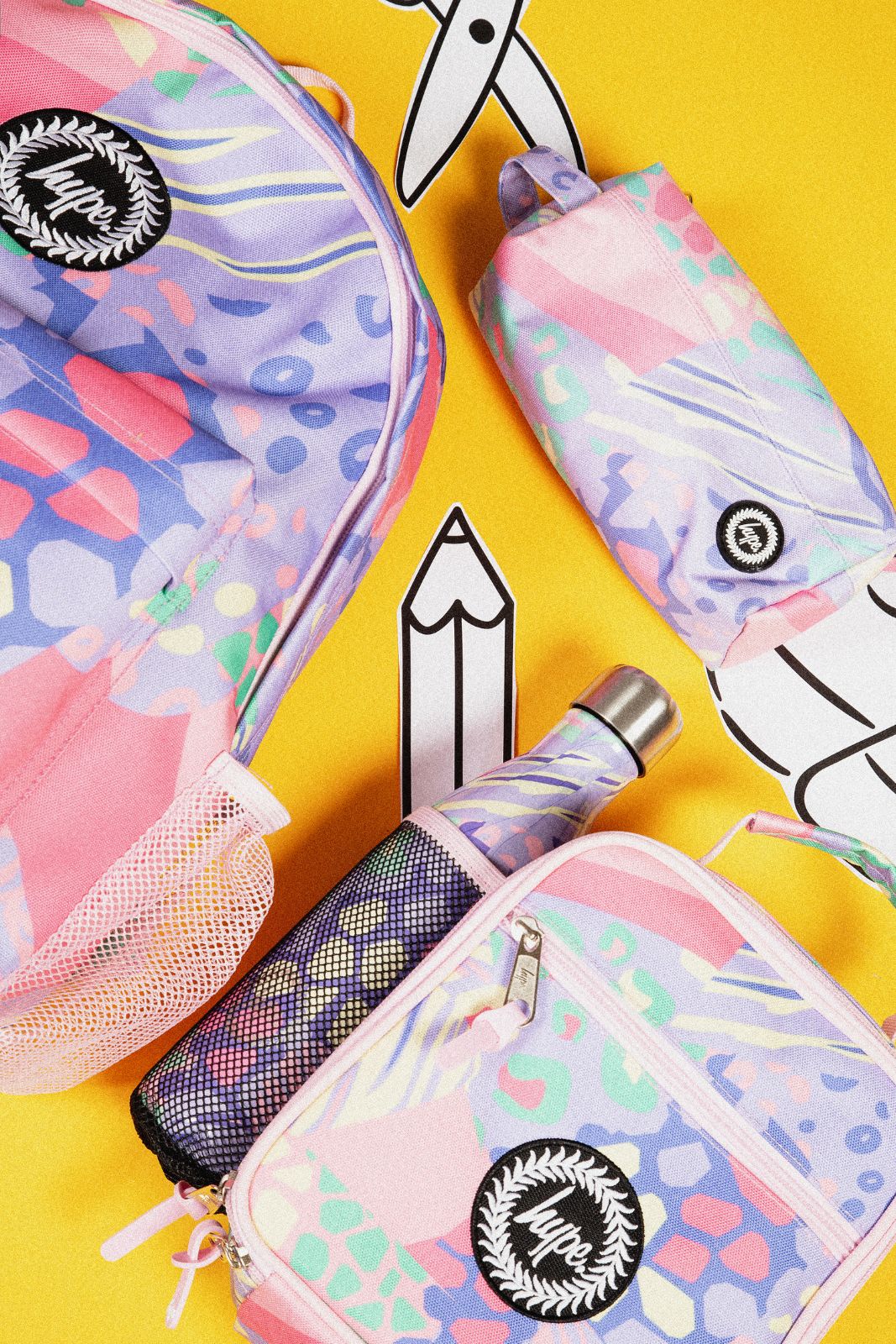 kids backpack with matching pencil case and school accessories for size comparison