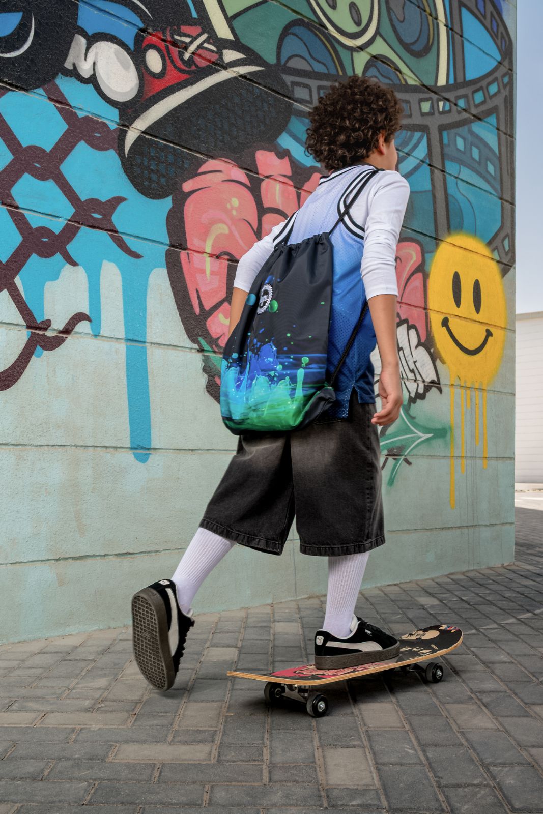 child skateboarding outdoors wearing a durable backpack for everyday use