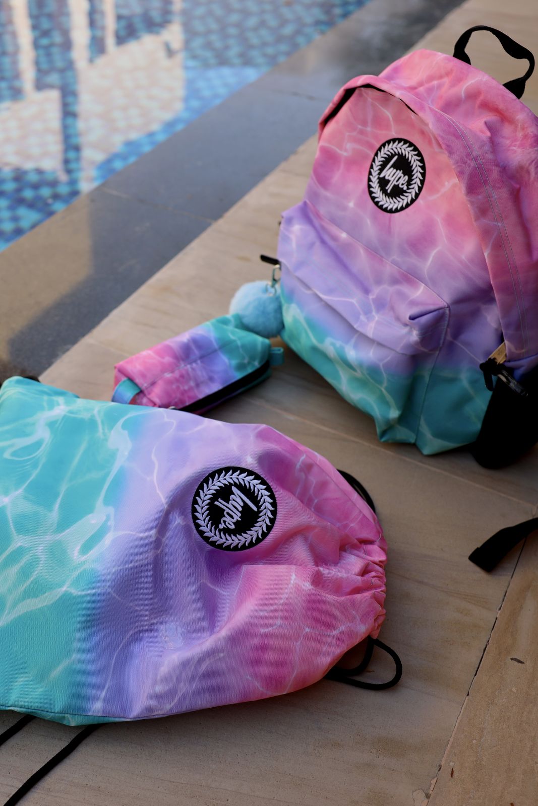 matching backpack and drawstring bag set in colorful streetwear design