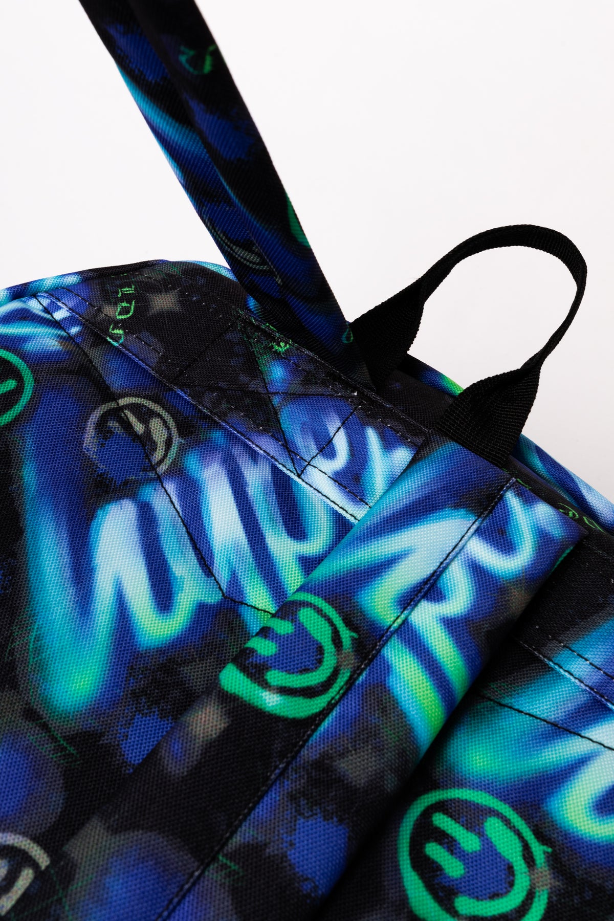 Hype Blue & Green Electric Smile backpack — padded back panel and adjustable straps